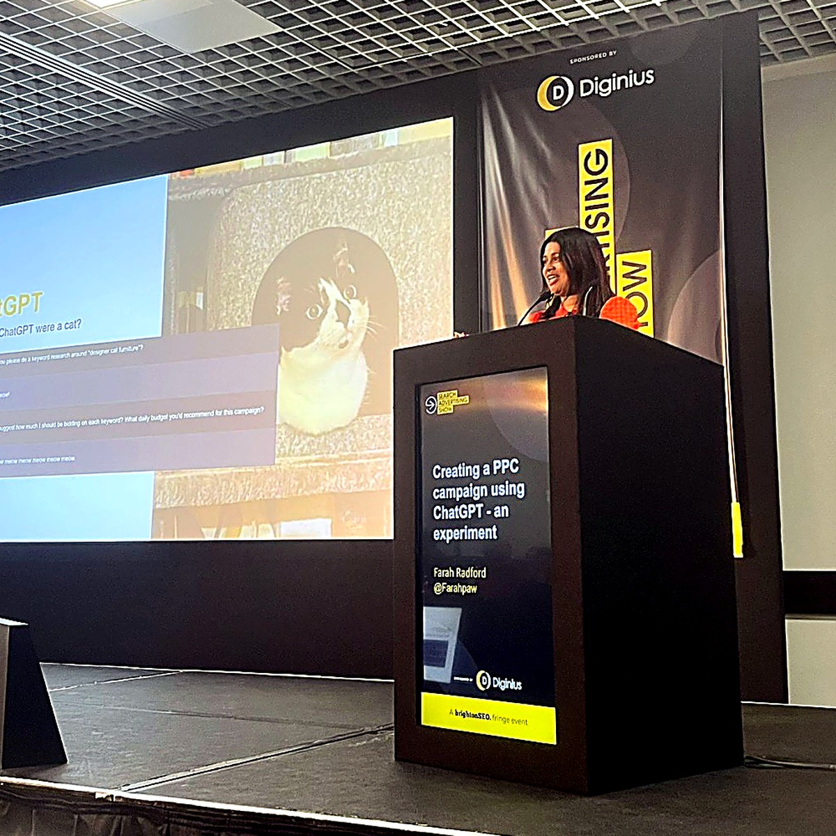 Farah speaking on stage (photo 3)